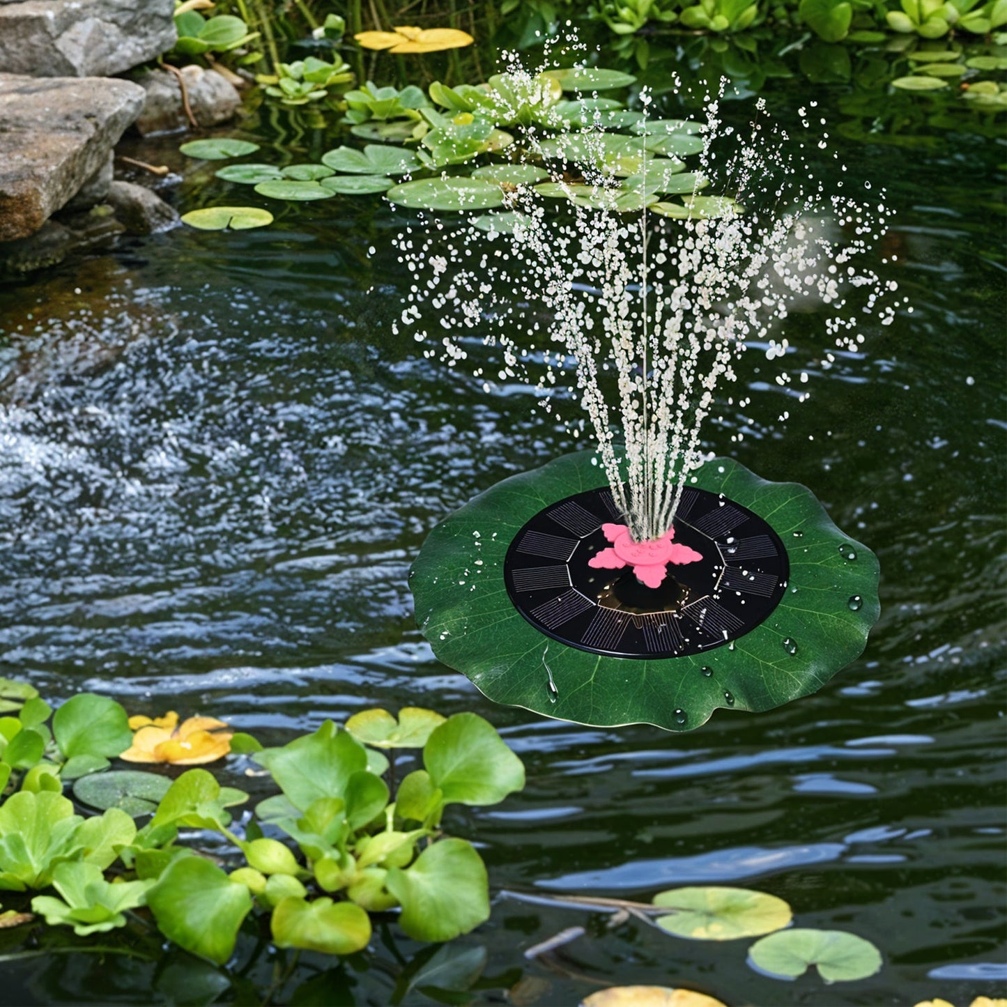 Decorative solar-powered floating water fountain pump placed on water surface