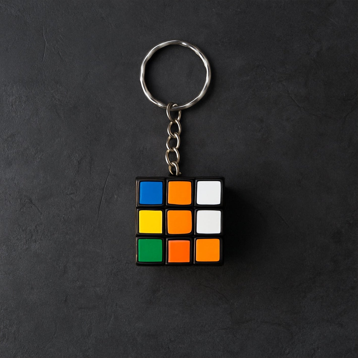 Detailed view of a Mini Magic Cube Puzzle keychain with bright, engaging colours.