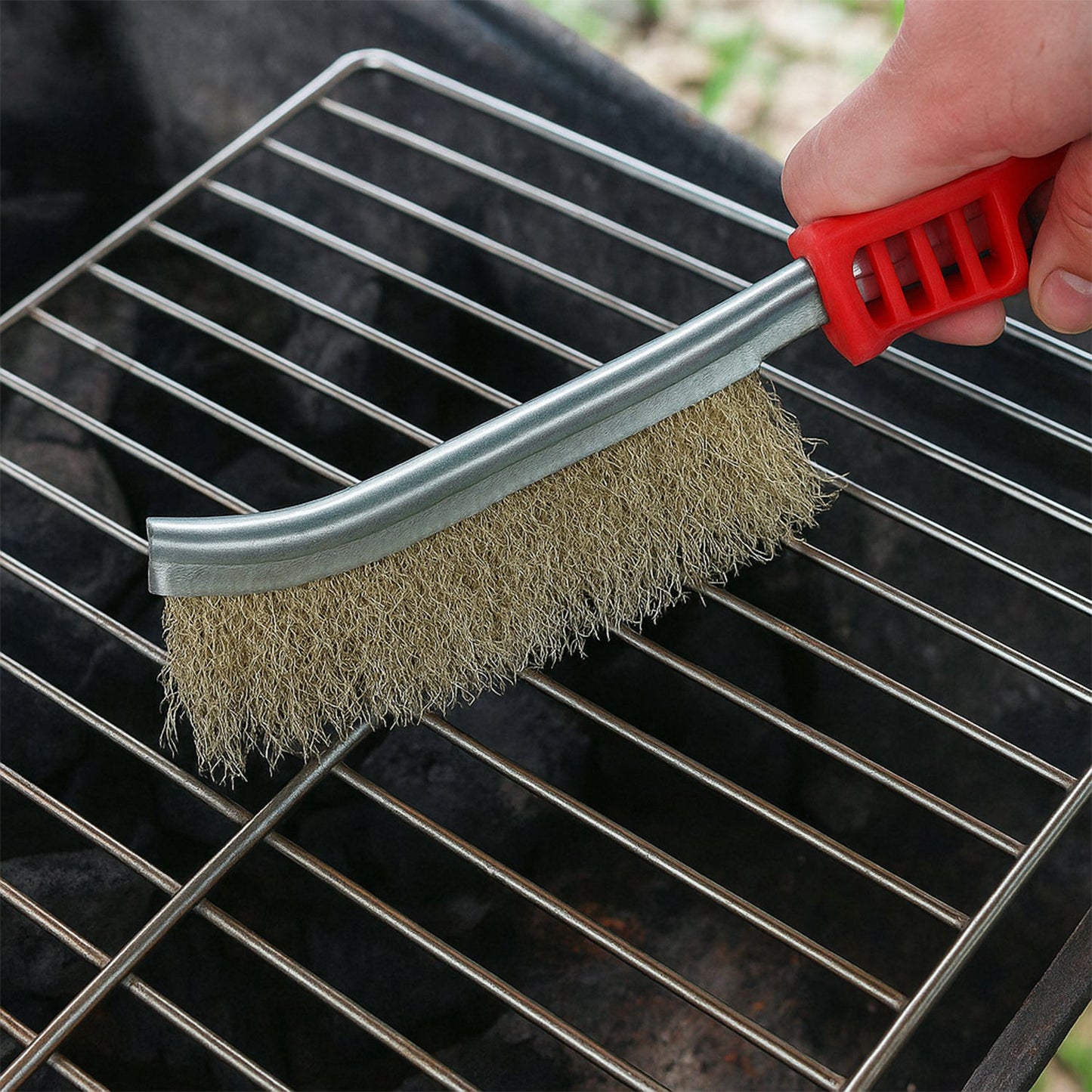 The versatile stainless steel wire brush effectively removing grime.