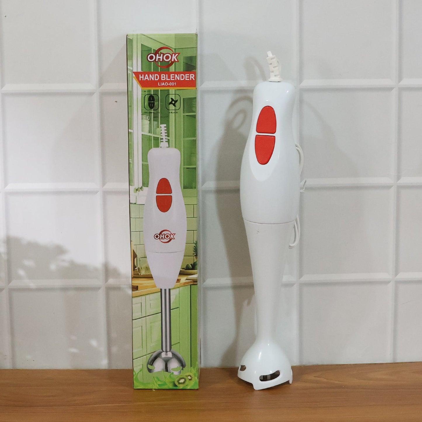 Electric hand blender stick placed on kitchen counter for use