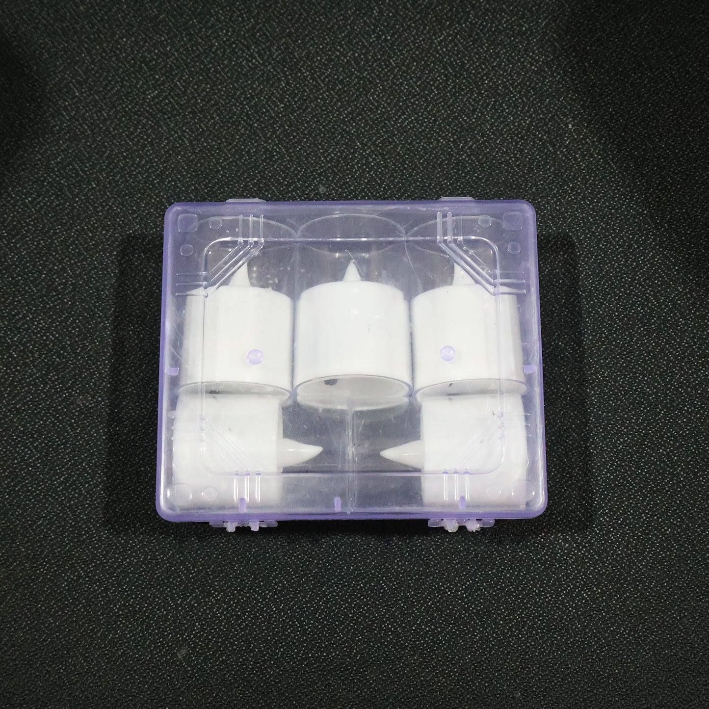 Battery-operated flameless votive candle lit softly for mood lighting