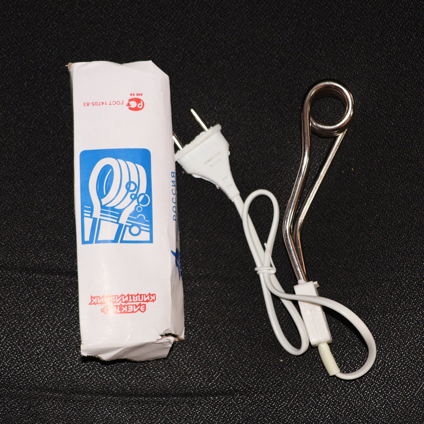 Fast heating immersion rod being used to quickly warm water for a bath