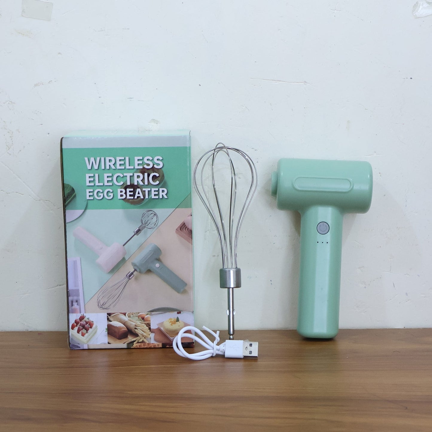 The compact Cordless Electric Whisk resting on a clean kitchen counter.