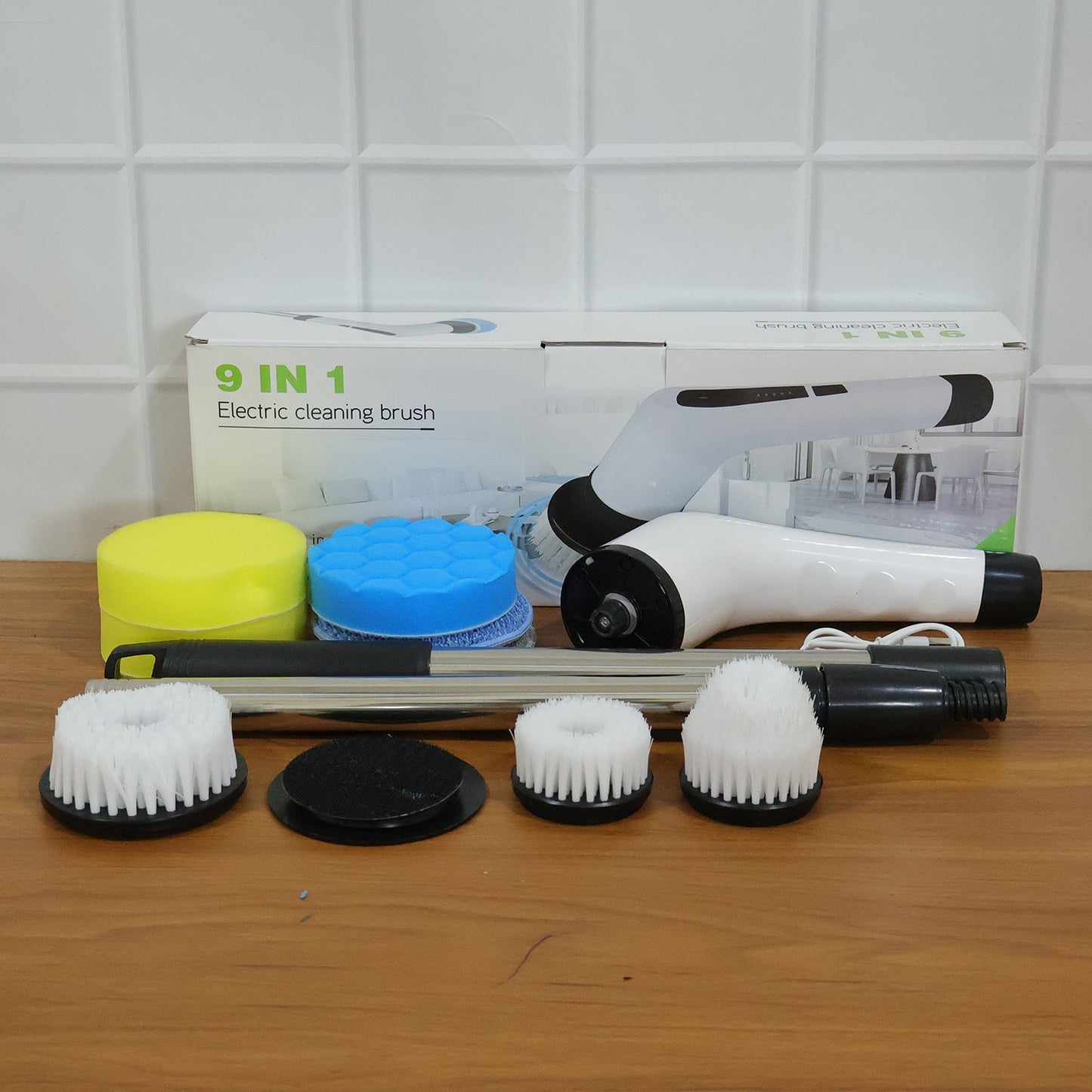 The complete 9-in-1 electric spin scrubber set laid out with all its cleaning brush heads.