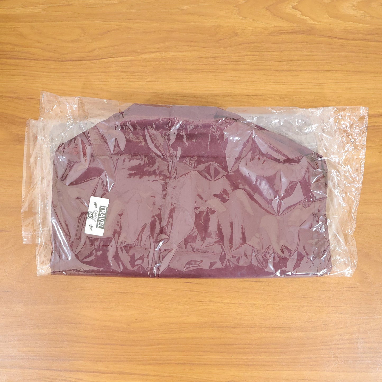 Soft travel shoe storage bag in use showing spacious interior and handles