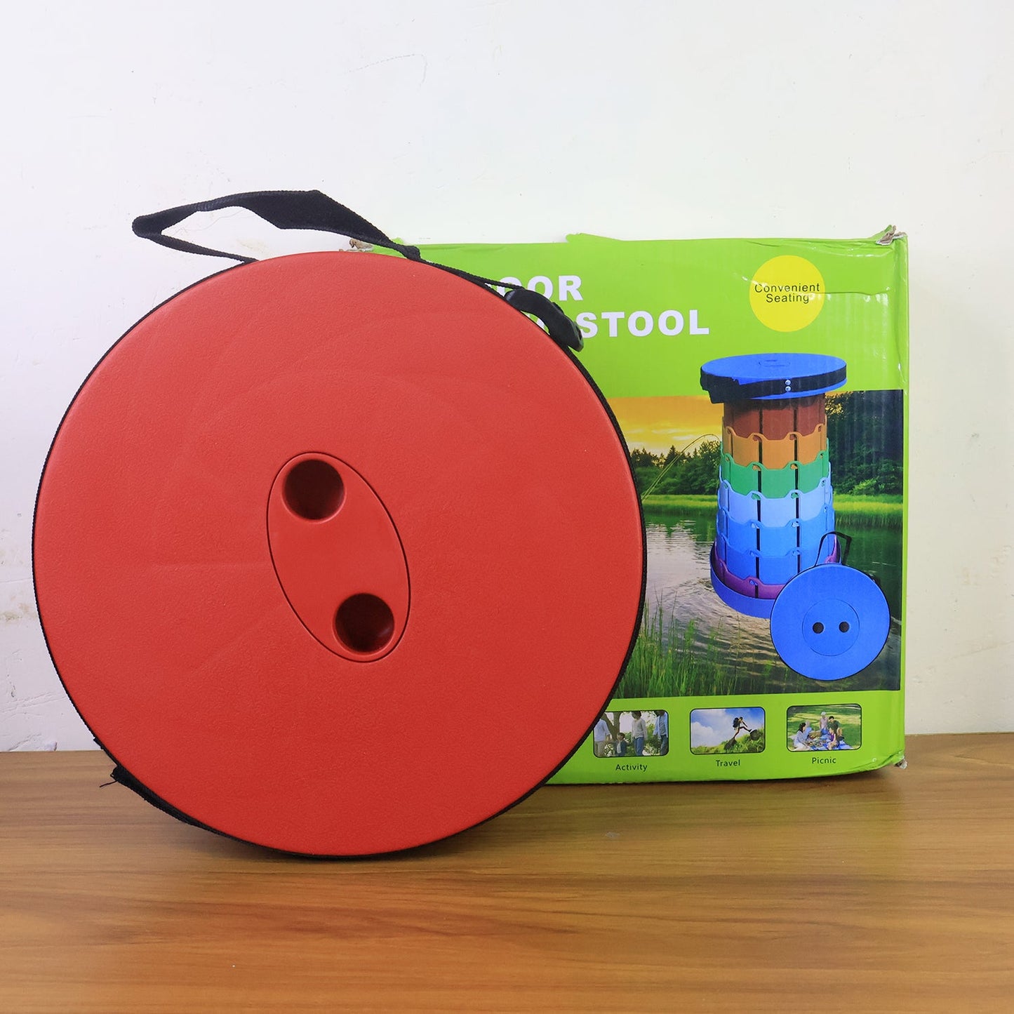 Portable folding stool demonstrating adjustable height feature
