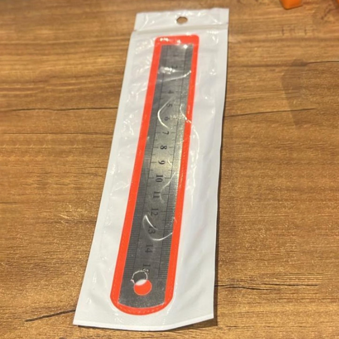 Measuring scale ruler being used to draw precise lines
