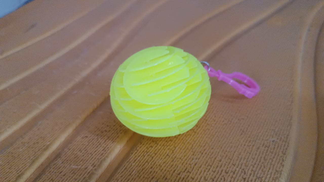Worm fidget toy in various flexible shapes on white surface
