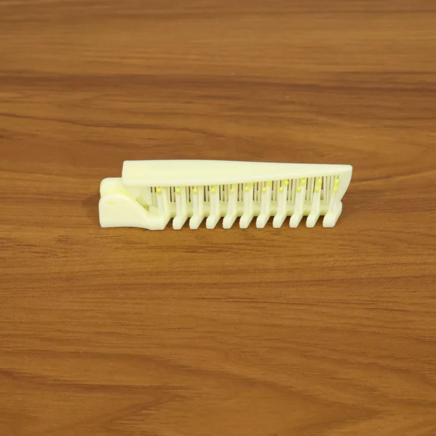 Open foldable hair comb & brush ready for styling