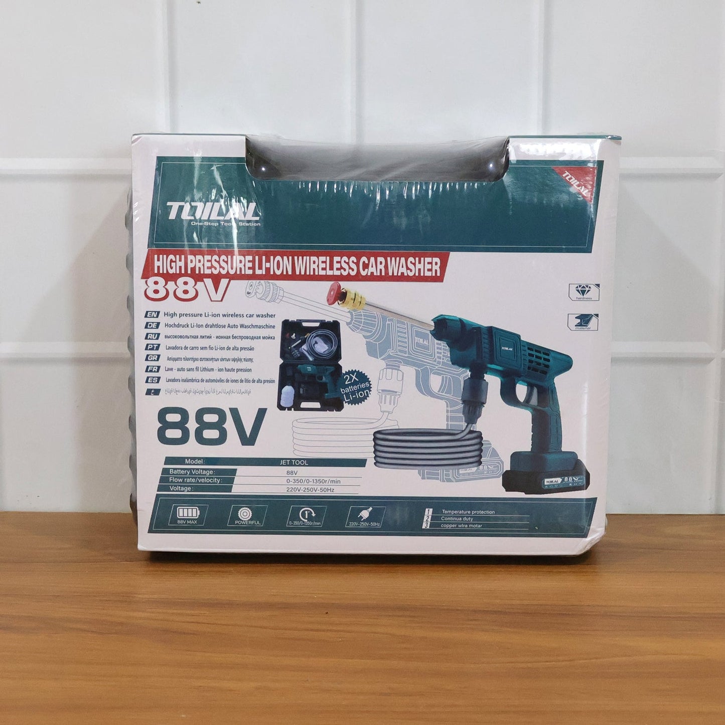 Outdoor cordless car washer gun with accessories laid out