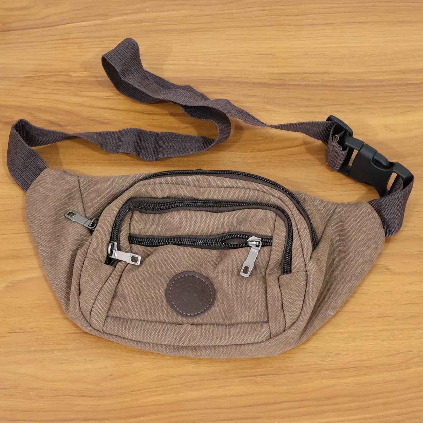 Top view of compact canvas waist bag designed for men and women