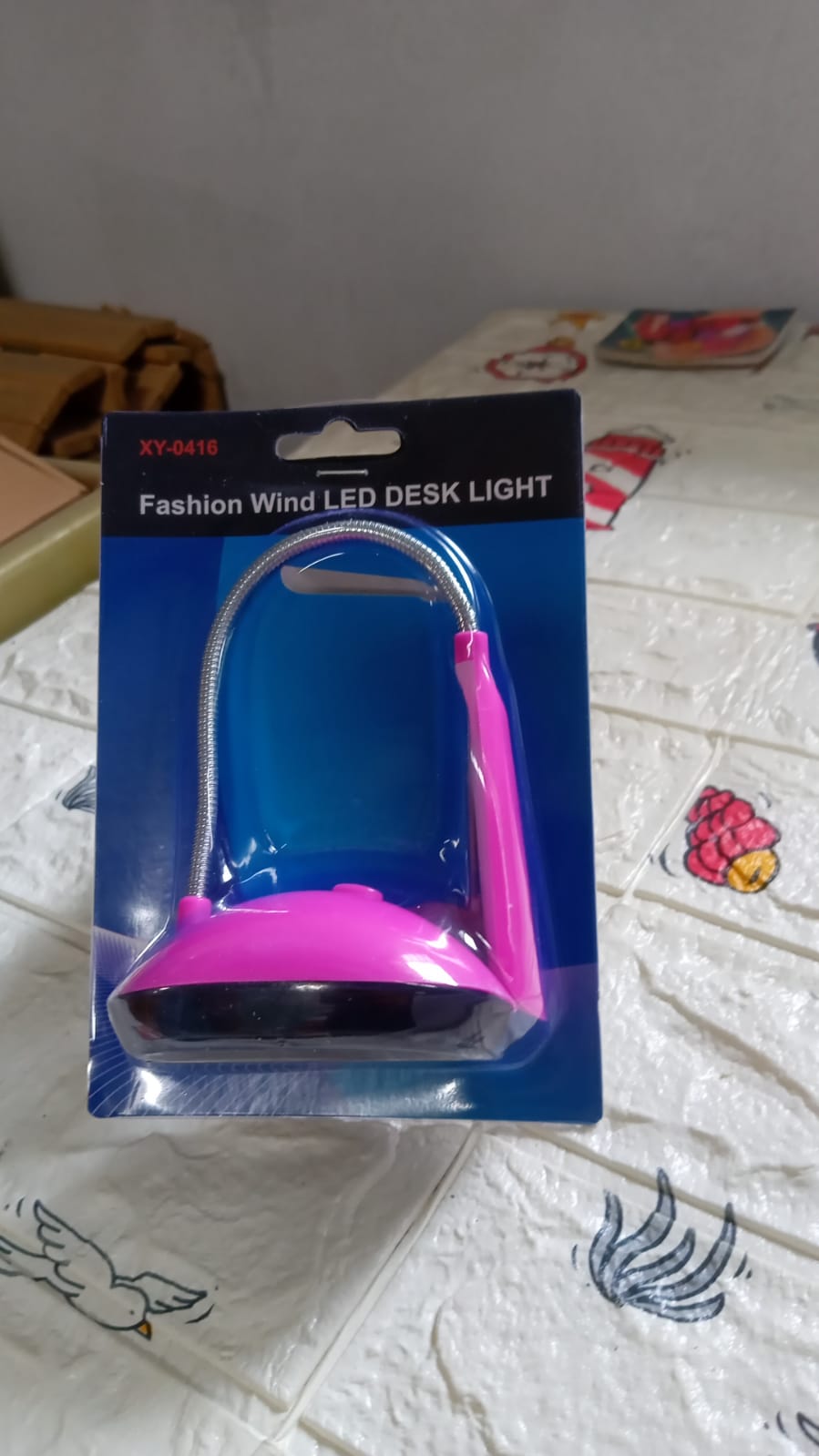 Compact and portable LED desk light featuring a flexible, adjustable arm.