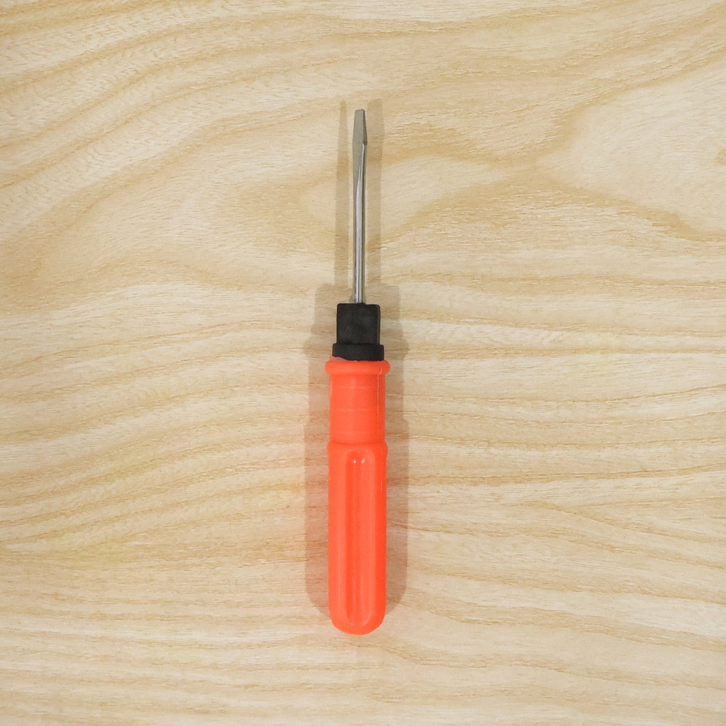 Live product shot of 2 in 1 screwdriver on wood surface