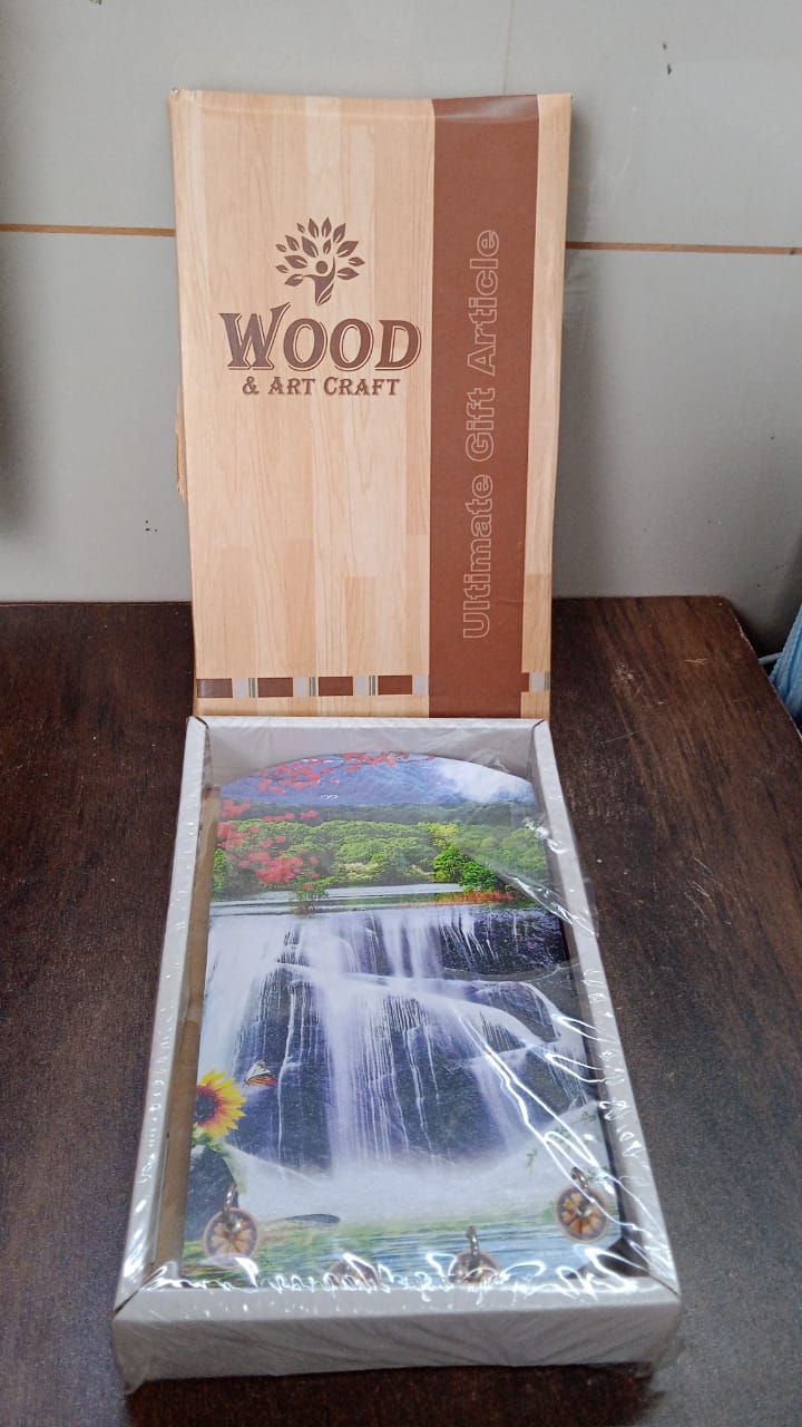 Decorative wooden wall panel with hooks, showing intricate vertical scenery.