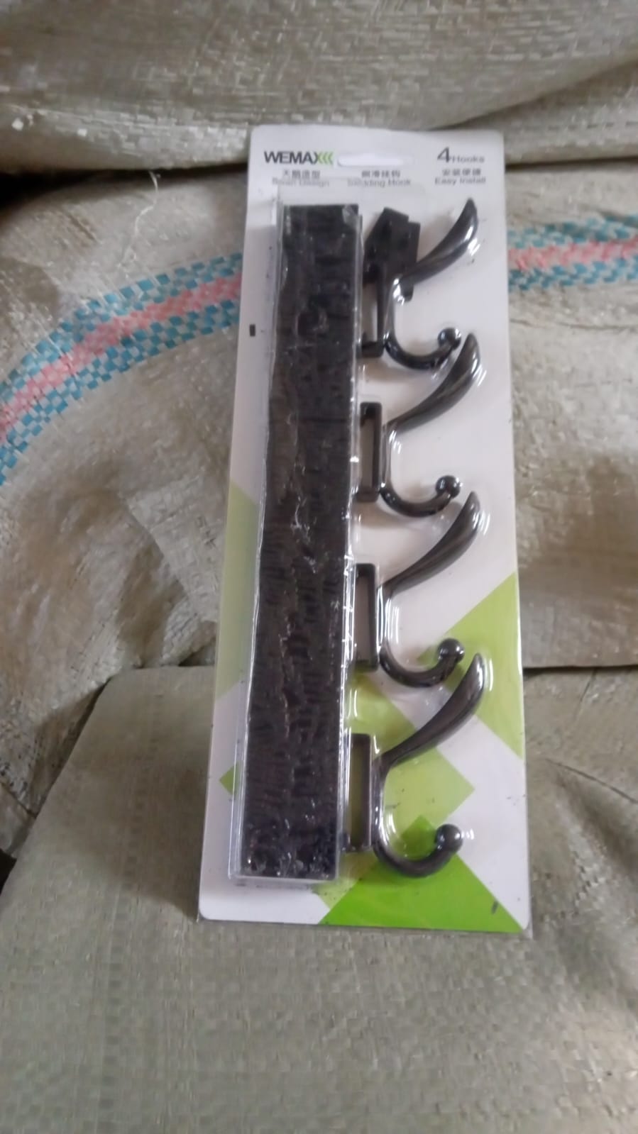 Eco-friendly adhesive and mounting accessories for the GlimmerHome coat hanger.