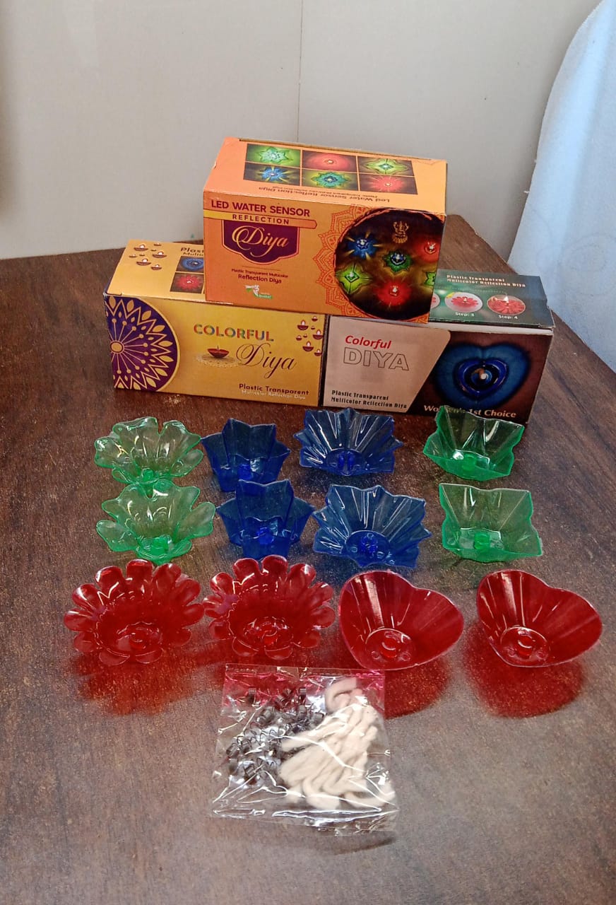 A festive arrangement of lit reflection diyas, creating a magical atmosphere for celebrations.
