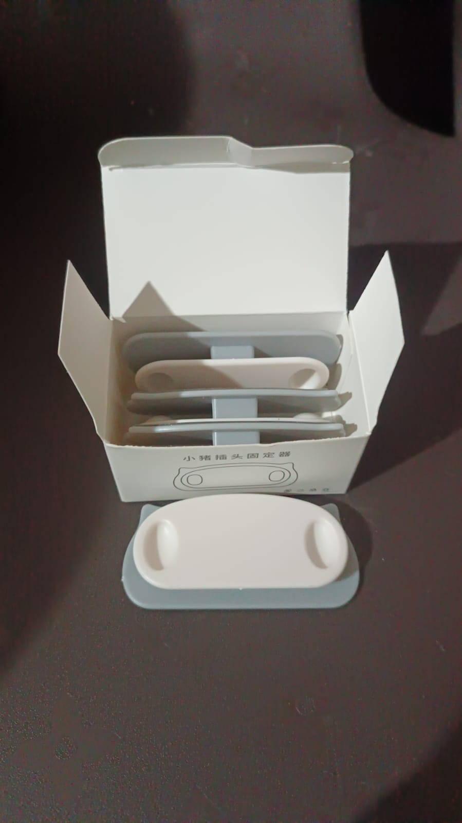 Pig plug shaped cable organizer clips holding multiple cables
