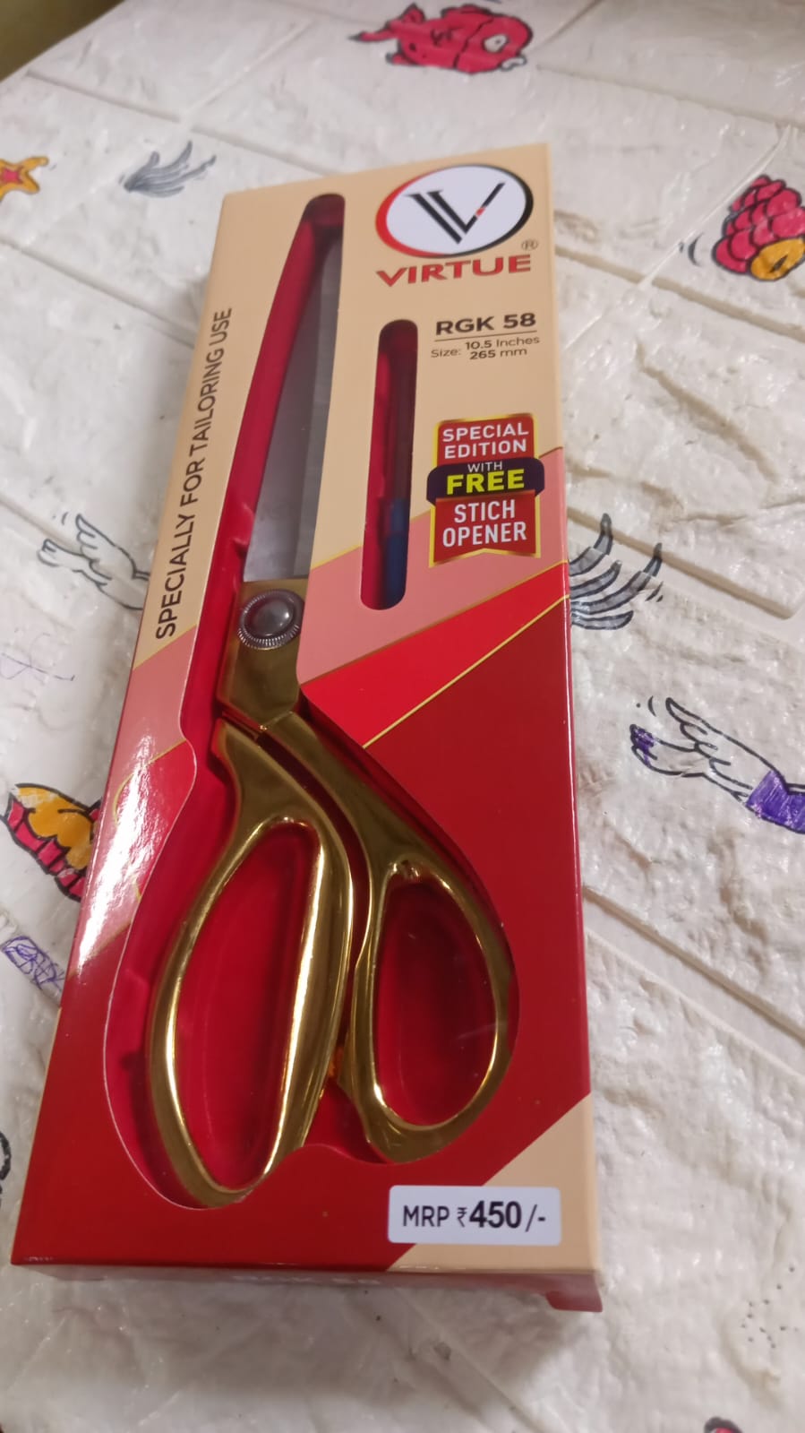 Durable stainless steel scissors, ideal for professional tailoring.