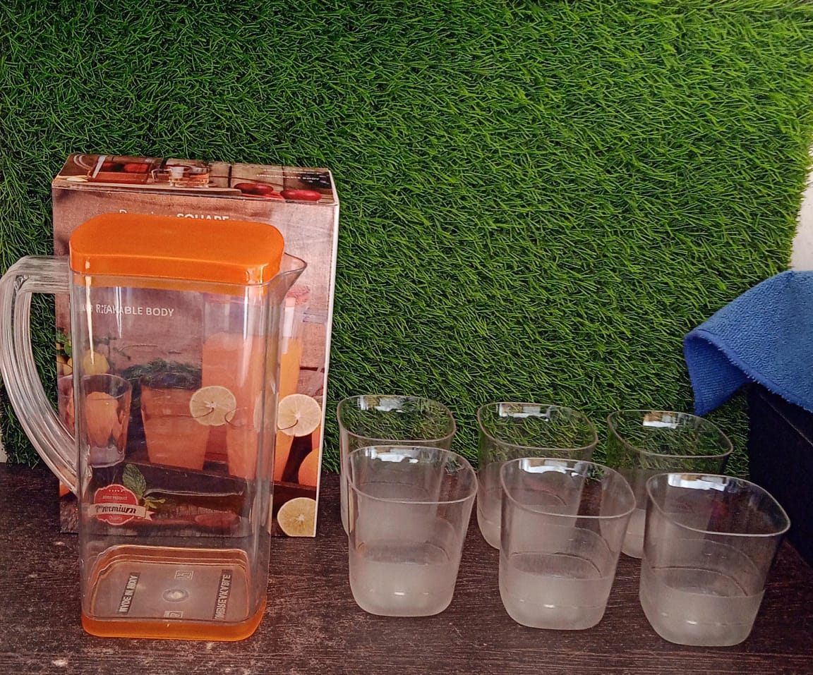 Detail of the sturdy, transparent plastic water jug, showing its sleek design.