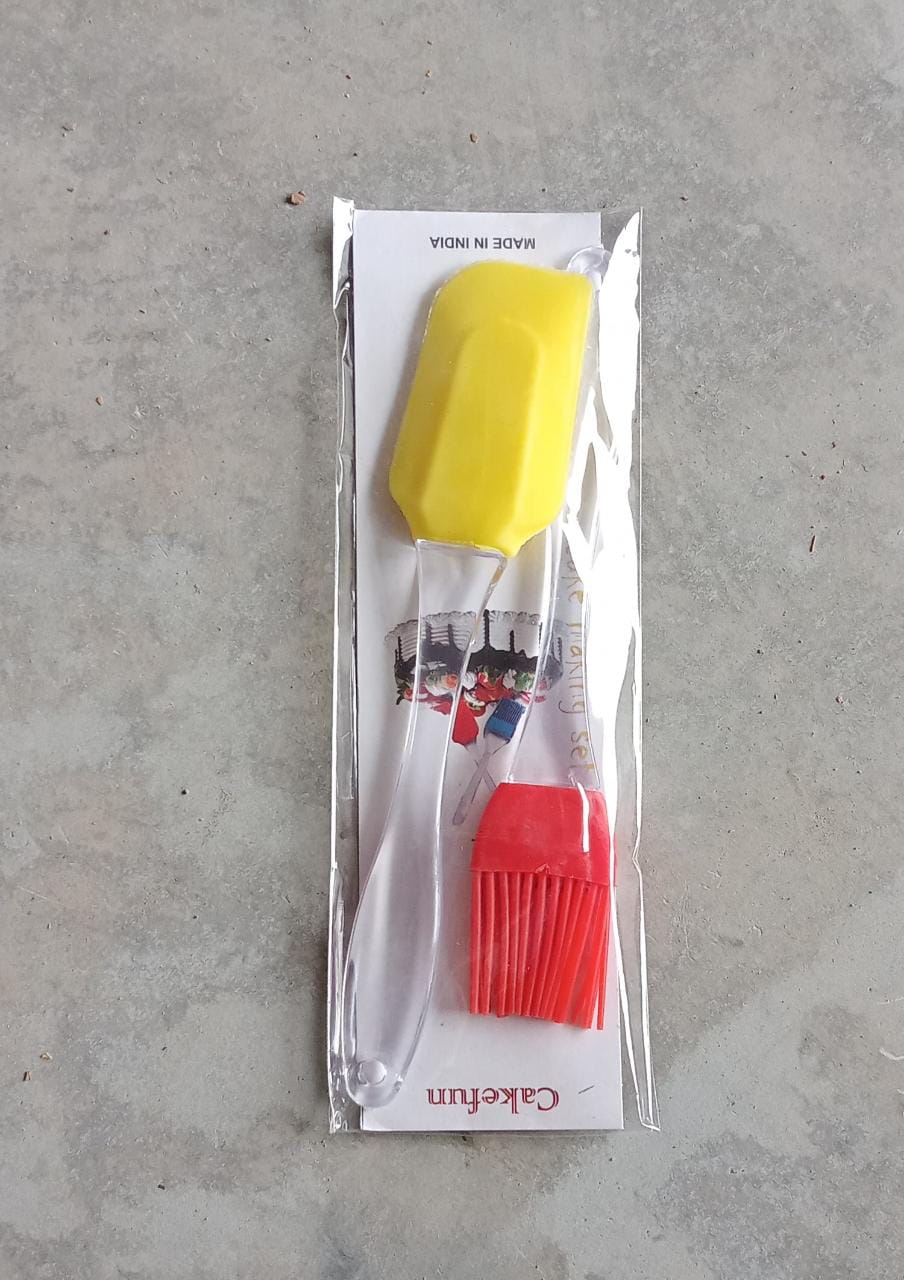 Multicolor silicone spatula and pastry brush set in action.