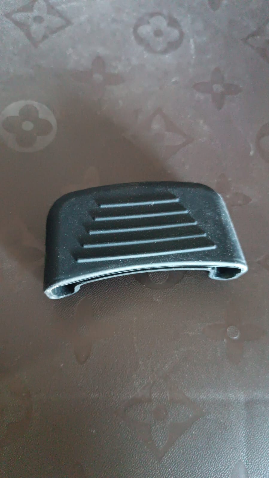 Close-up of silicone pot handle cover showing ribbed, non-slip texture