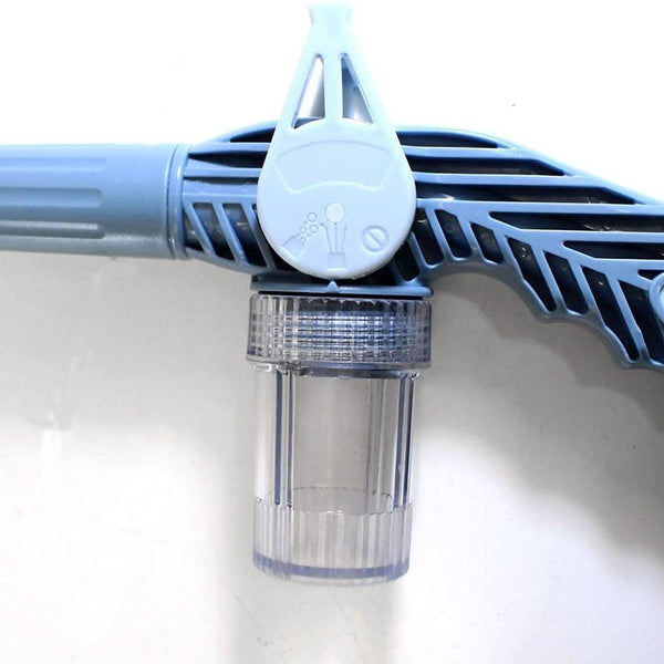 The 8-in-1 water spray gun placed in a vibrant garden environment.