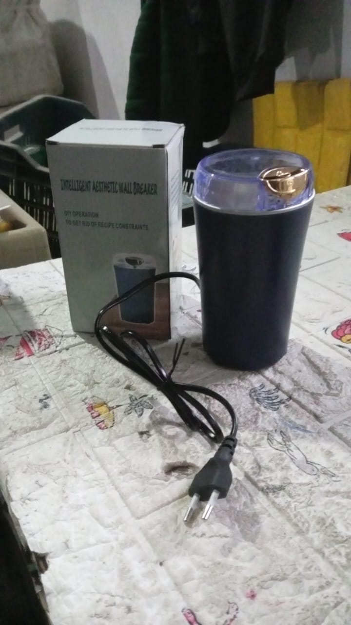Mini coffee grinder blender ready to grind fresh coffee beans.