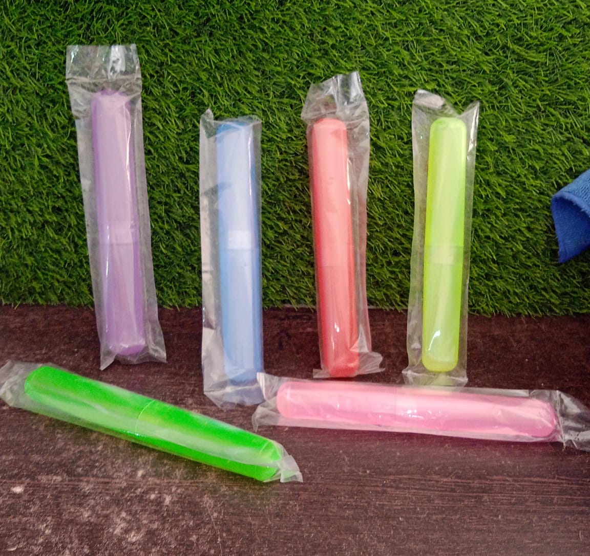Multiple compact plastic toothbrush cases for the entire family's travel needs.