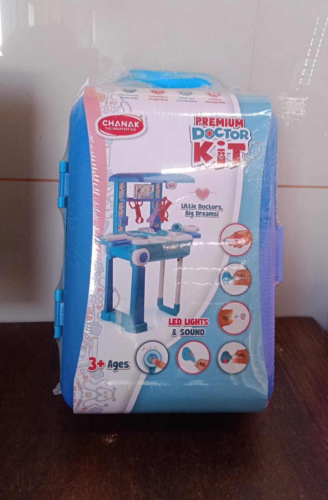 Packaging of the educational doctor trolley toy for kids, highlighting features.