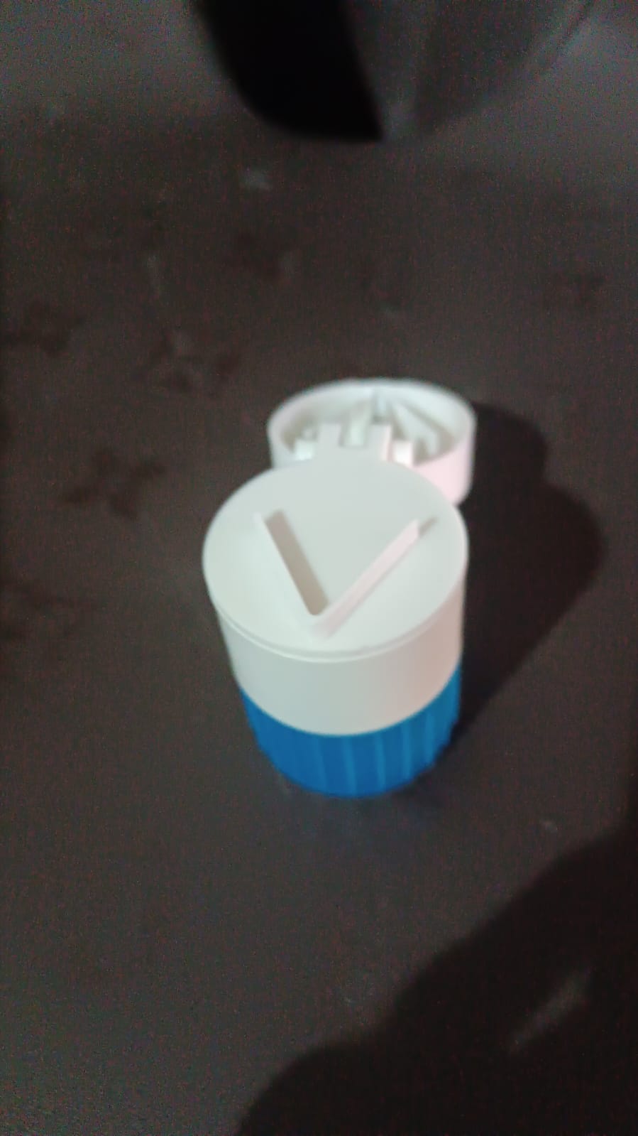 Front view of the Organivo 4-in-1 portable medicine cutter and storage box.