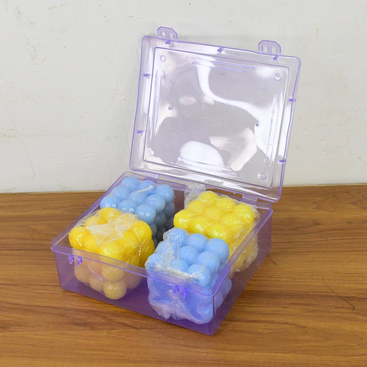 Cube wax candles lit to show calming and attractive decorative glow
