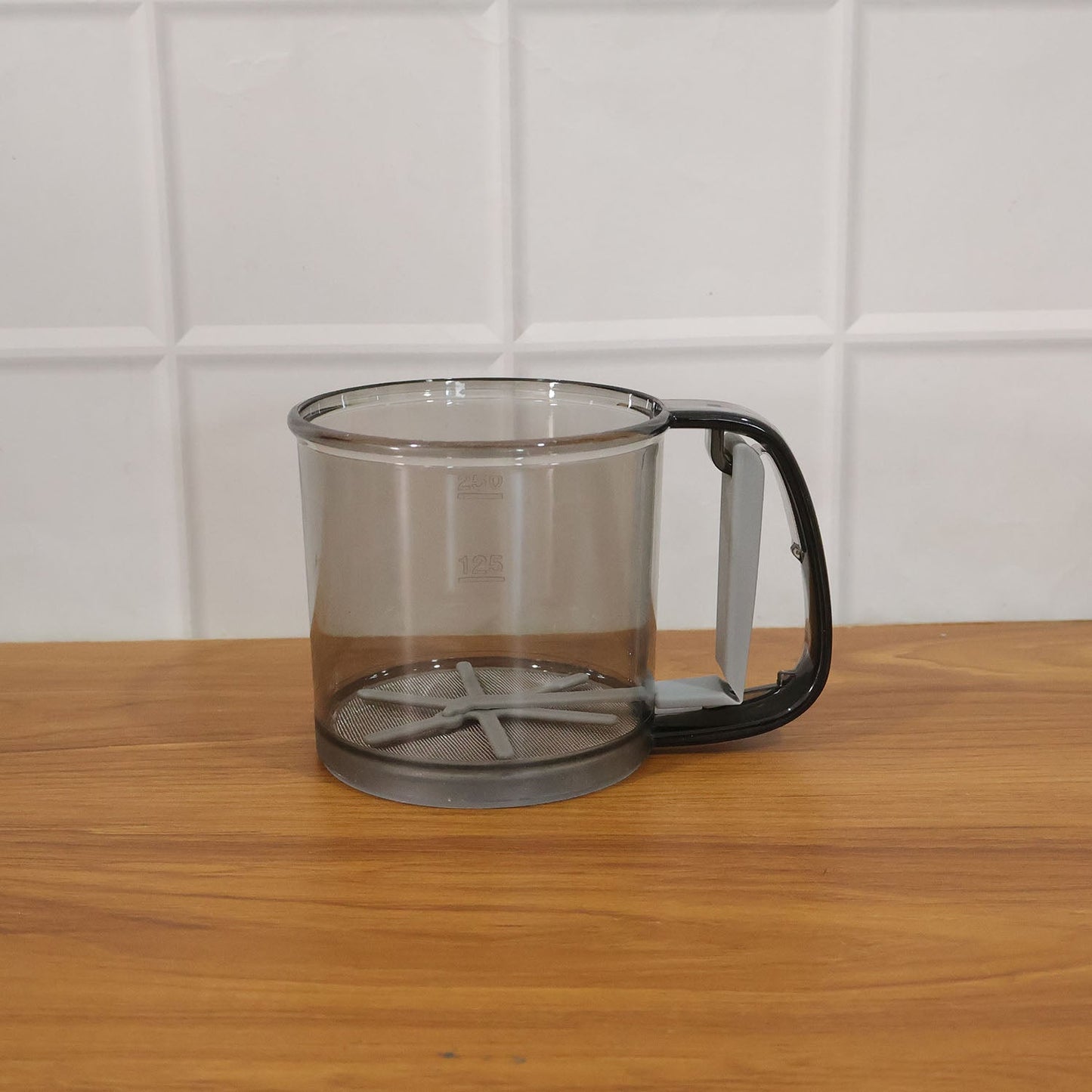 Kitchen baking gadget plastic flour sieve cup in use