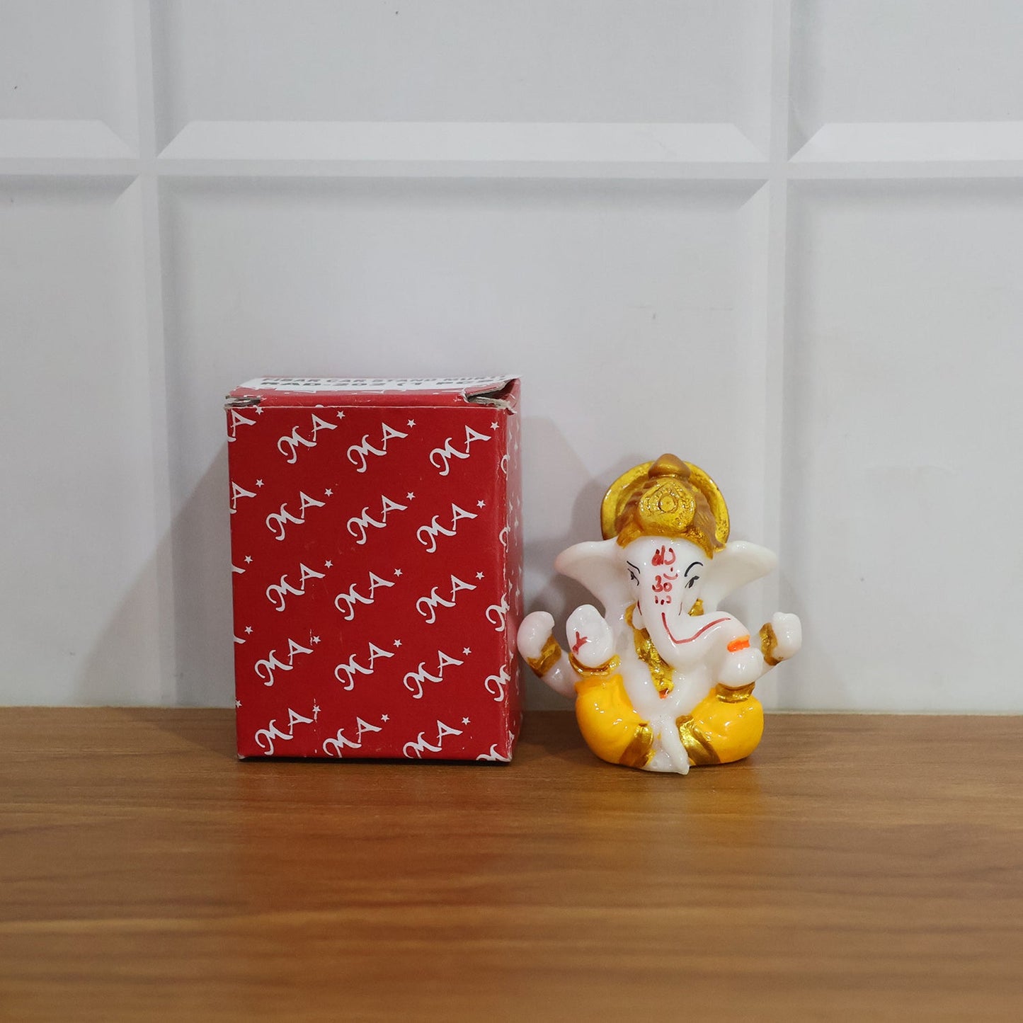 Blessings from Lord Ganesha idol with golden crown craft