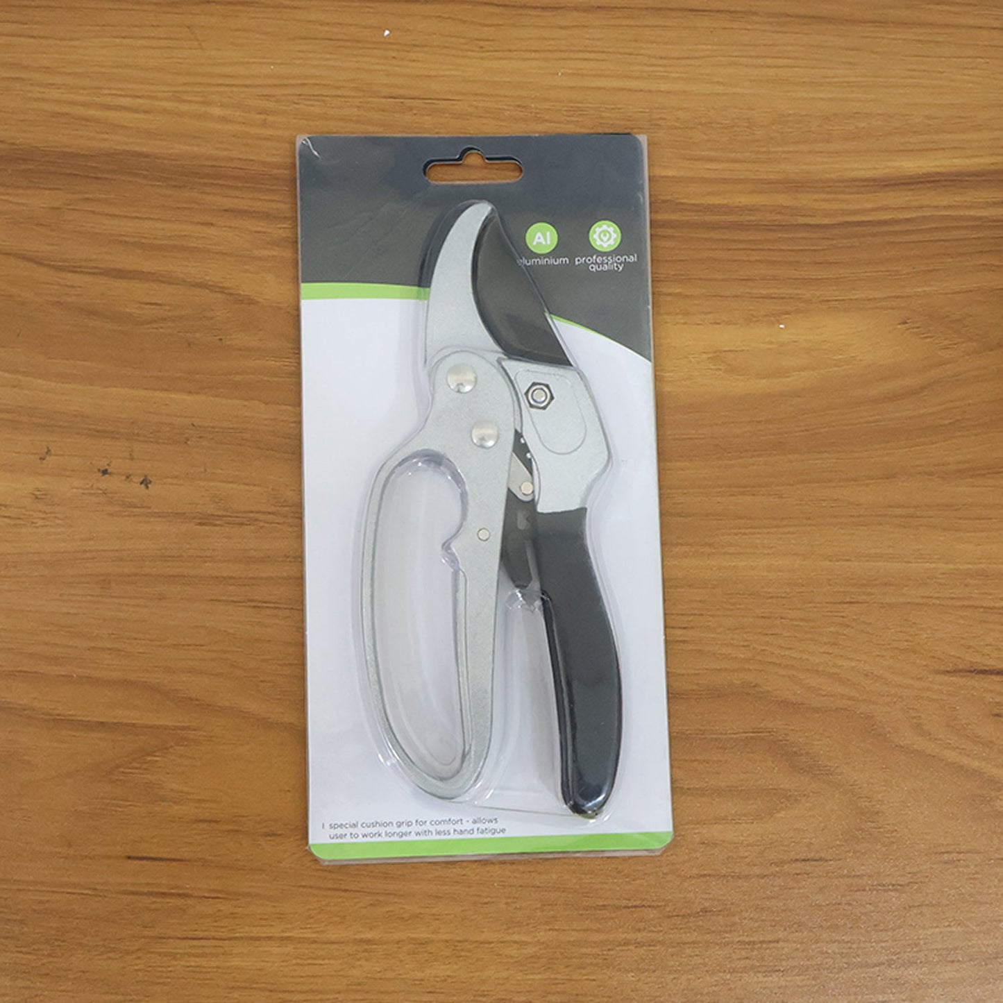 Indo Glow gardening pruning shears displayed next to fresh green foliage, ready for garden tasks.