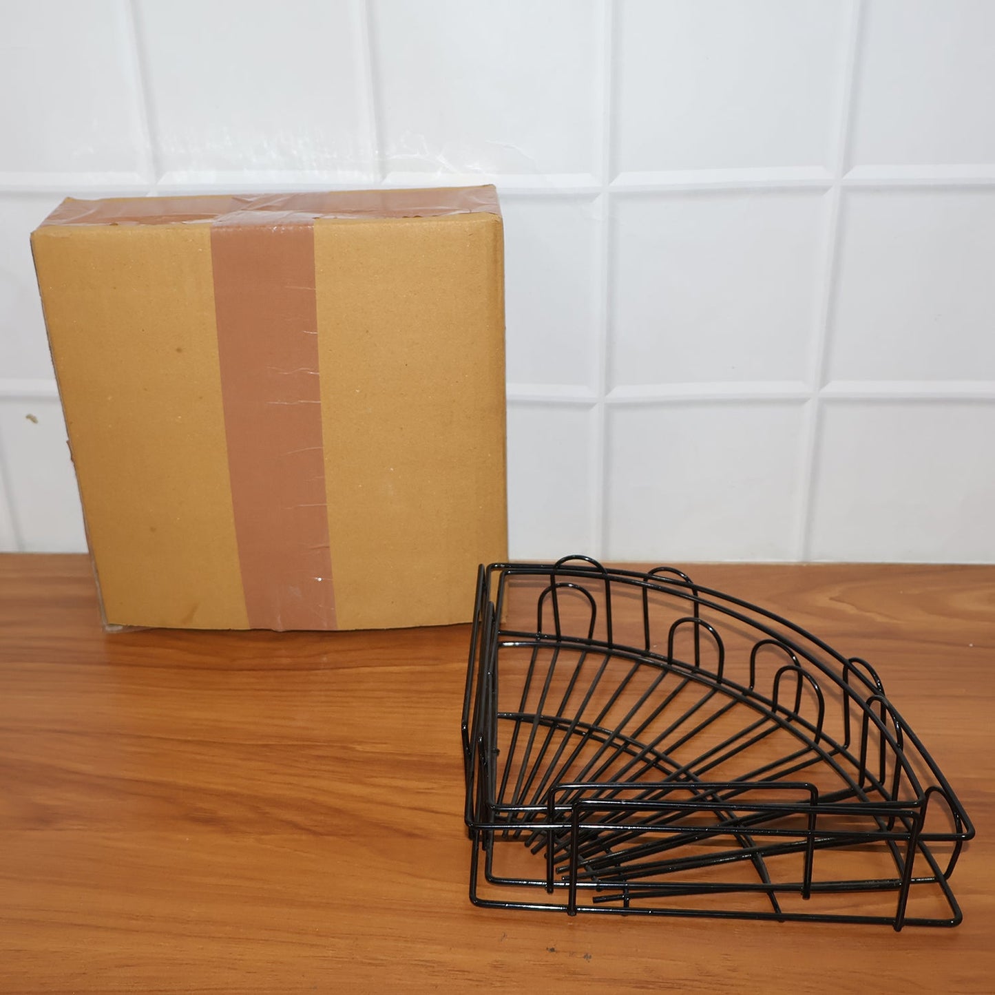 Iron shower caddy corner discreetly installed in a contemporary living space, offering utility.