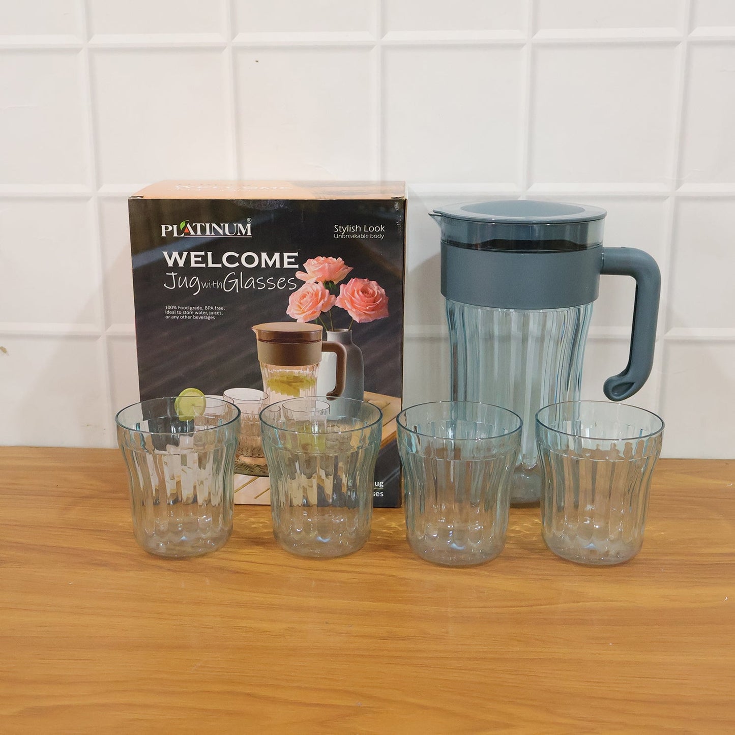 Plastic water jug with 4 glasses for serving beverages