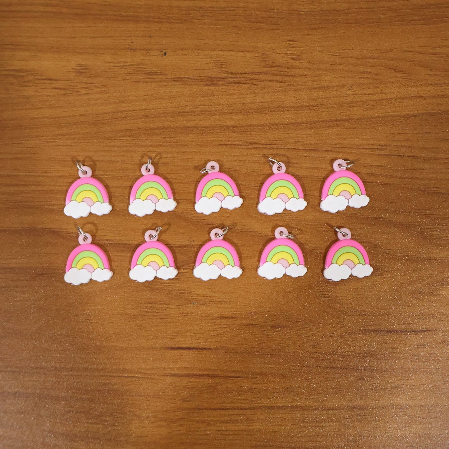 Rainbow cloud keychains on display, vibrant and lightweight