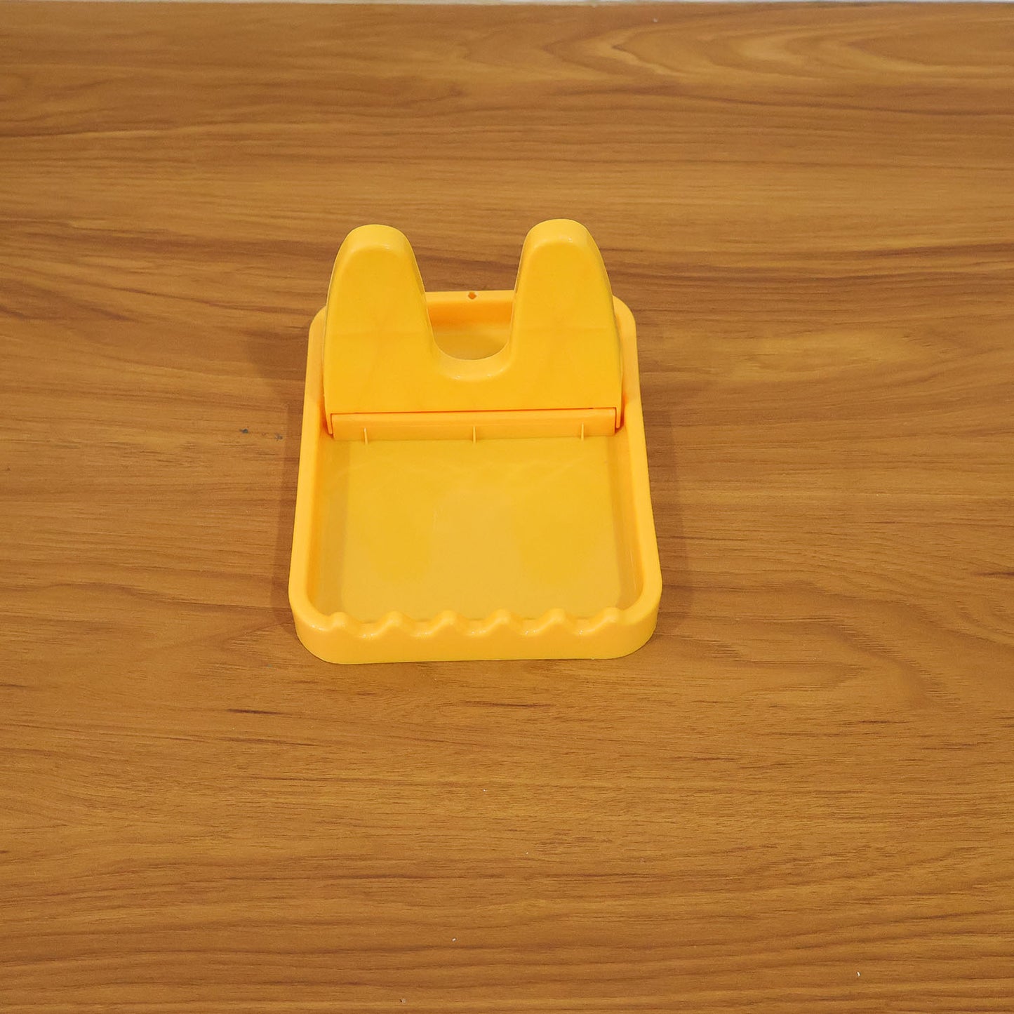 Kitchen lid and spoon holder stand in use with utensils and lids