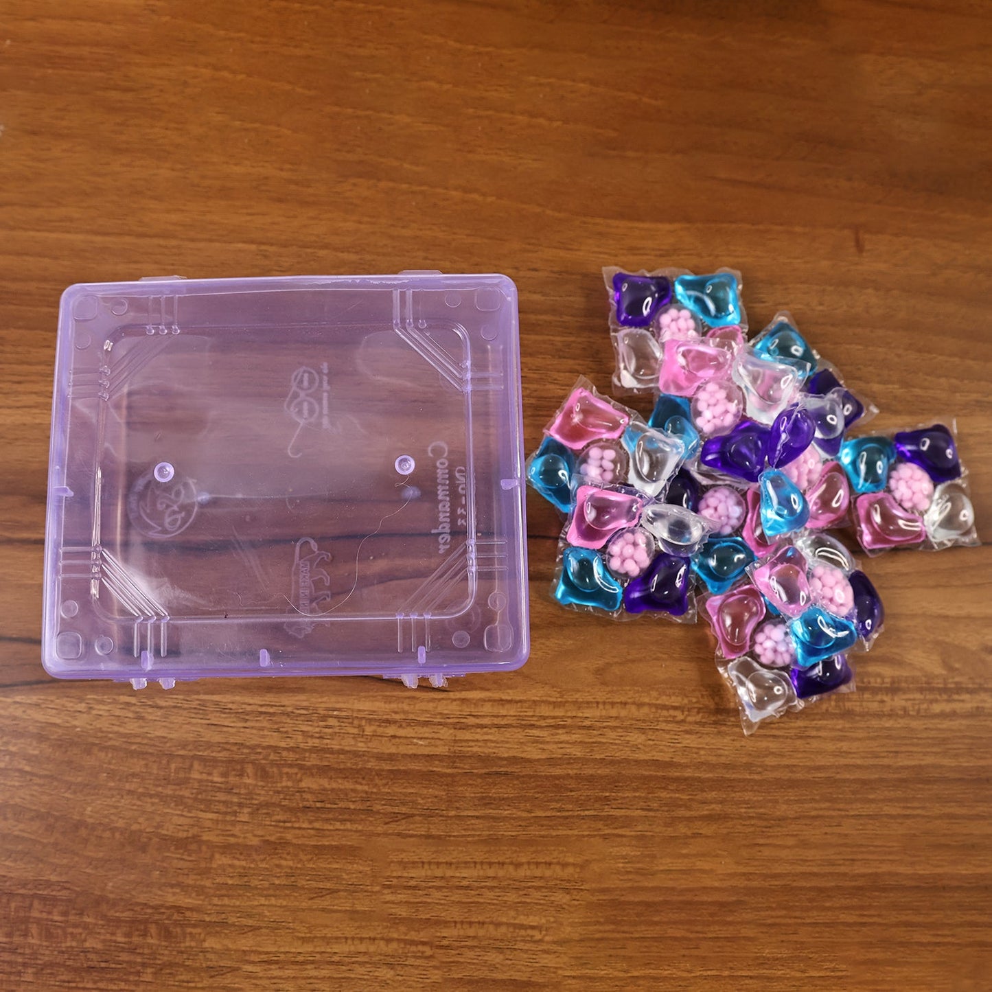Compact pack of Laundry Detergent Pods with stain remover, brightener, and softener