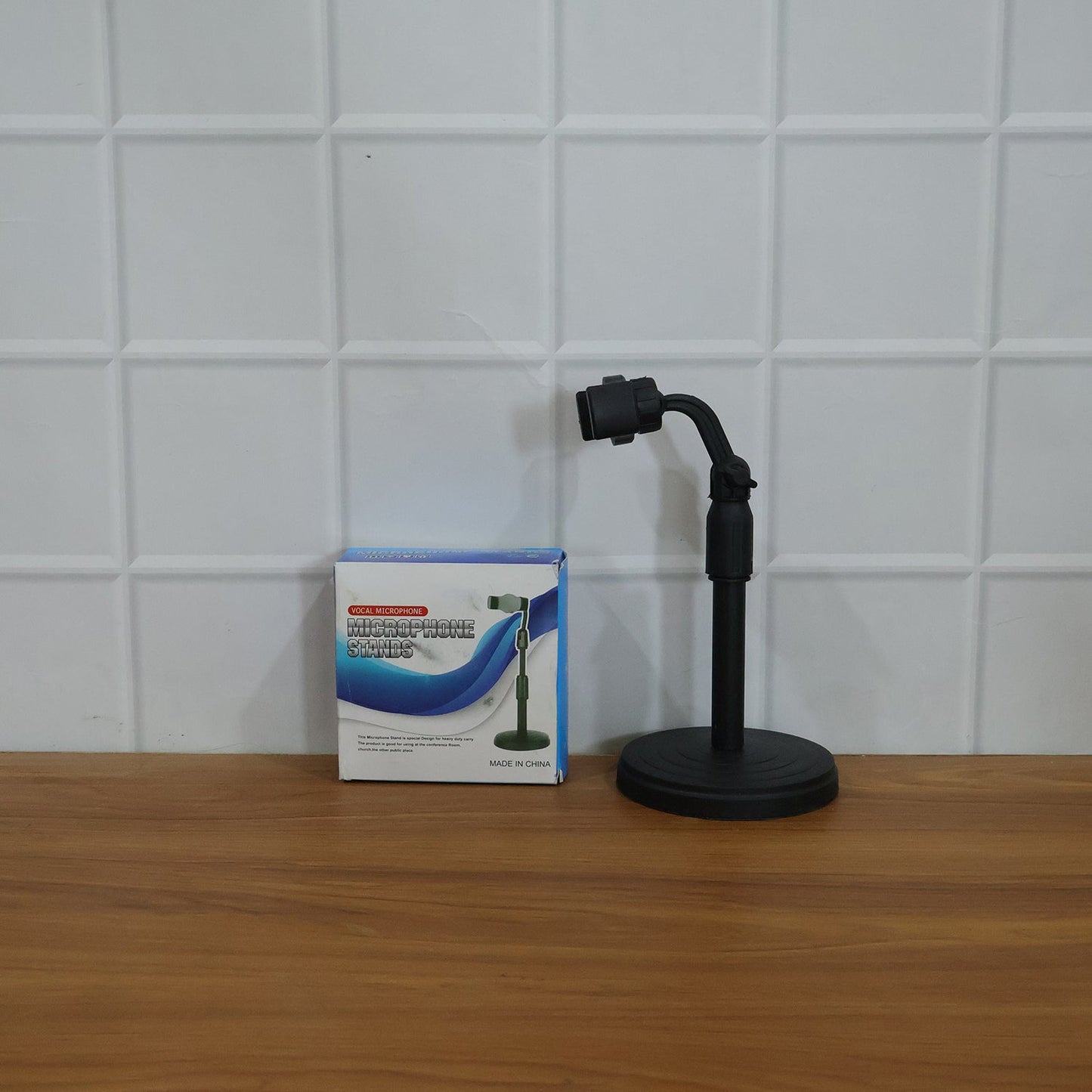 Desk setup with adjustable mobile phone holder stand