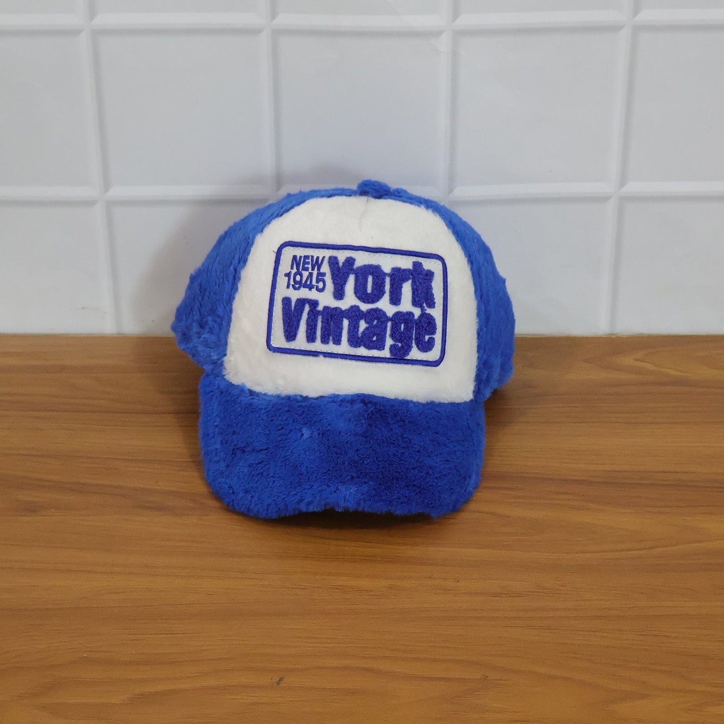Live modeling shot of vintage plush winter cap