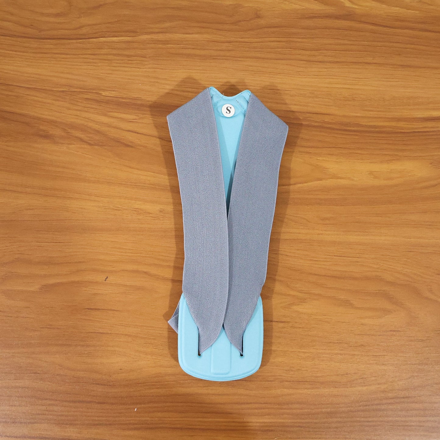 Posture corrector worn by model for back support