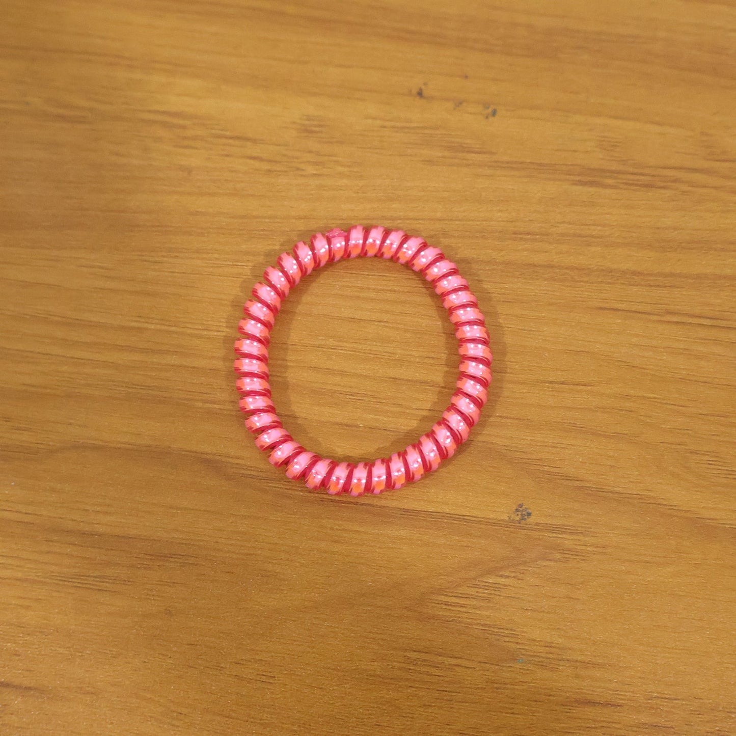 Strong elastic hair coil band for secure ponytails and buns