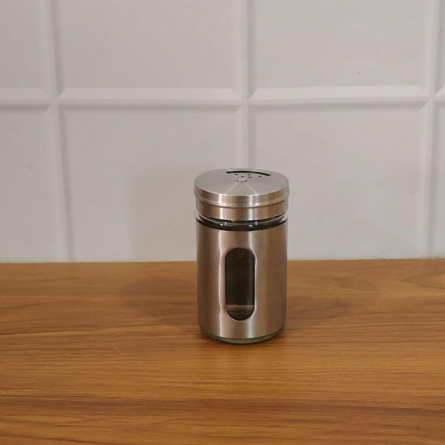 Lifestyle image of stainless steel spice jar in kitchen setting