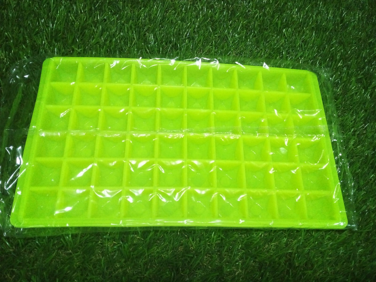 The compact 60-Cavity Ice Tray in its packaging, ready for shipping.