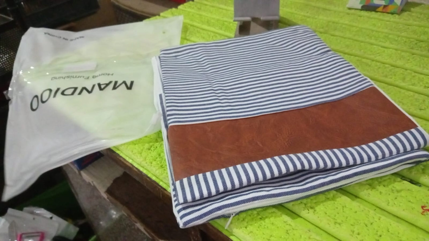 Stack of two stylish leather and cotton pillow covers for home decor