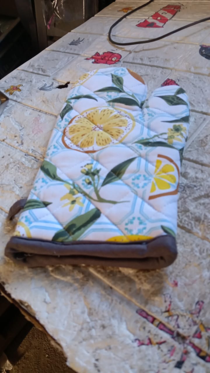 Lifestyle shot of the cotton baking glove in a modern kitchen setting.