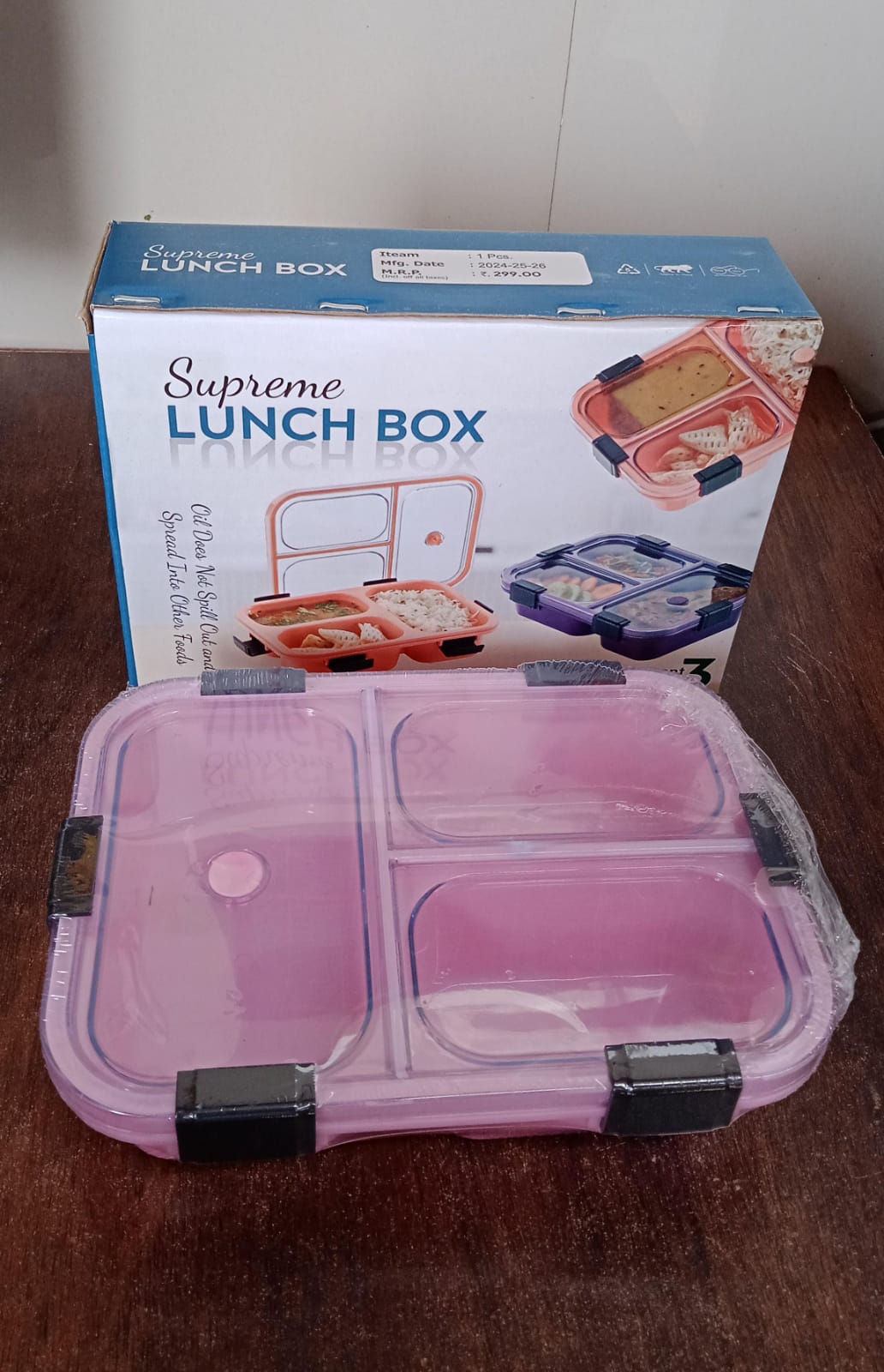 Insulated lunch box with internal compartments, designed for varied Indian meals.