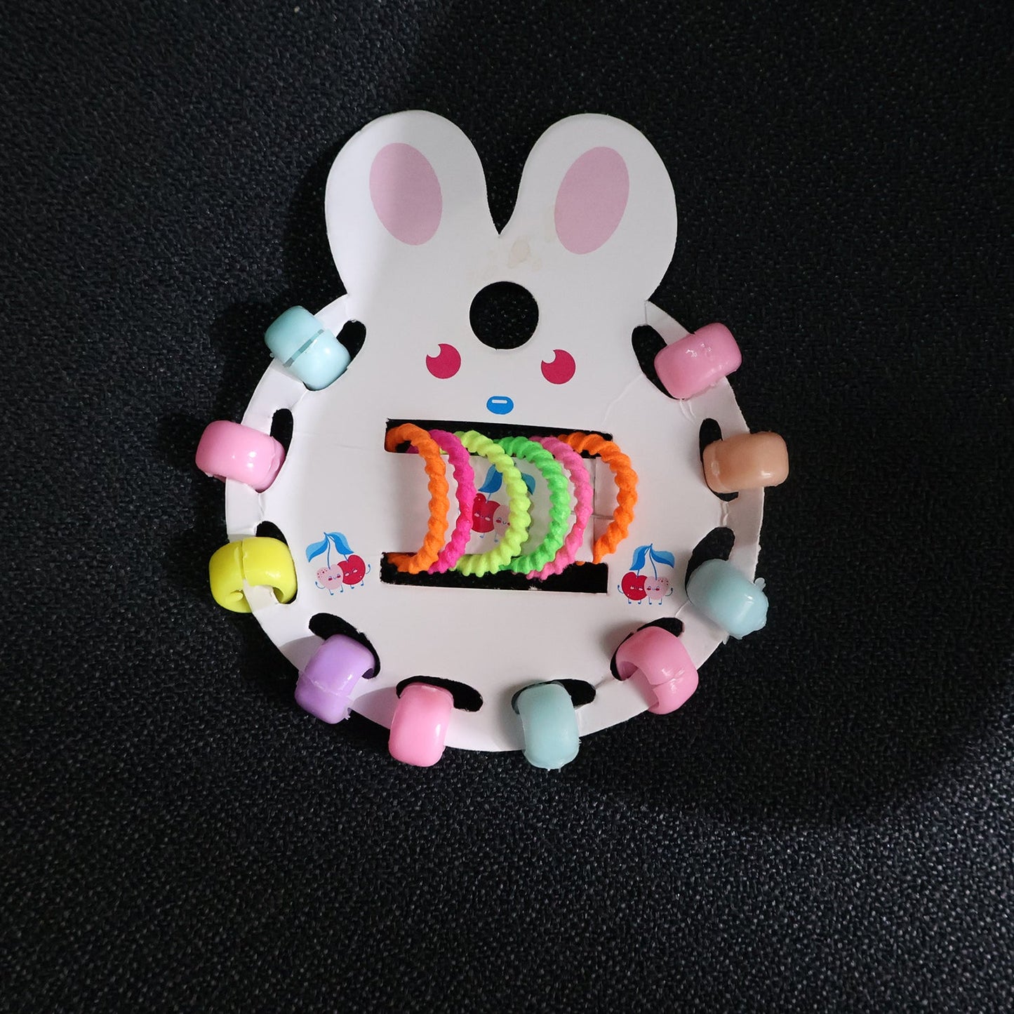 Young girl wearing pastel hairband from girls hair clip set