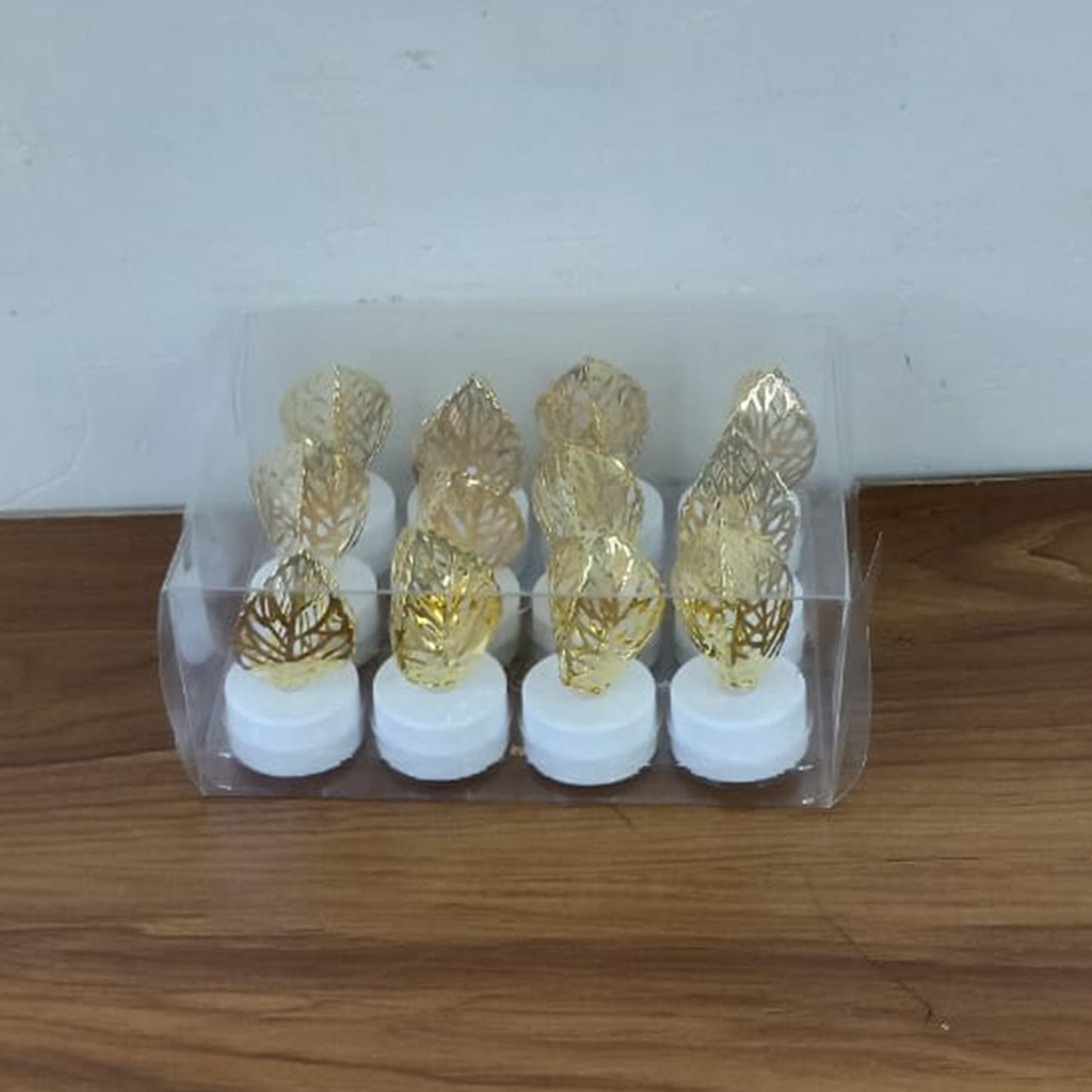 Romantic setting with golden leaf shaped flameless LED candle lighting
